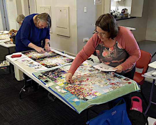 Maggie and Kim busy at work