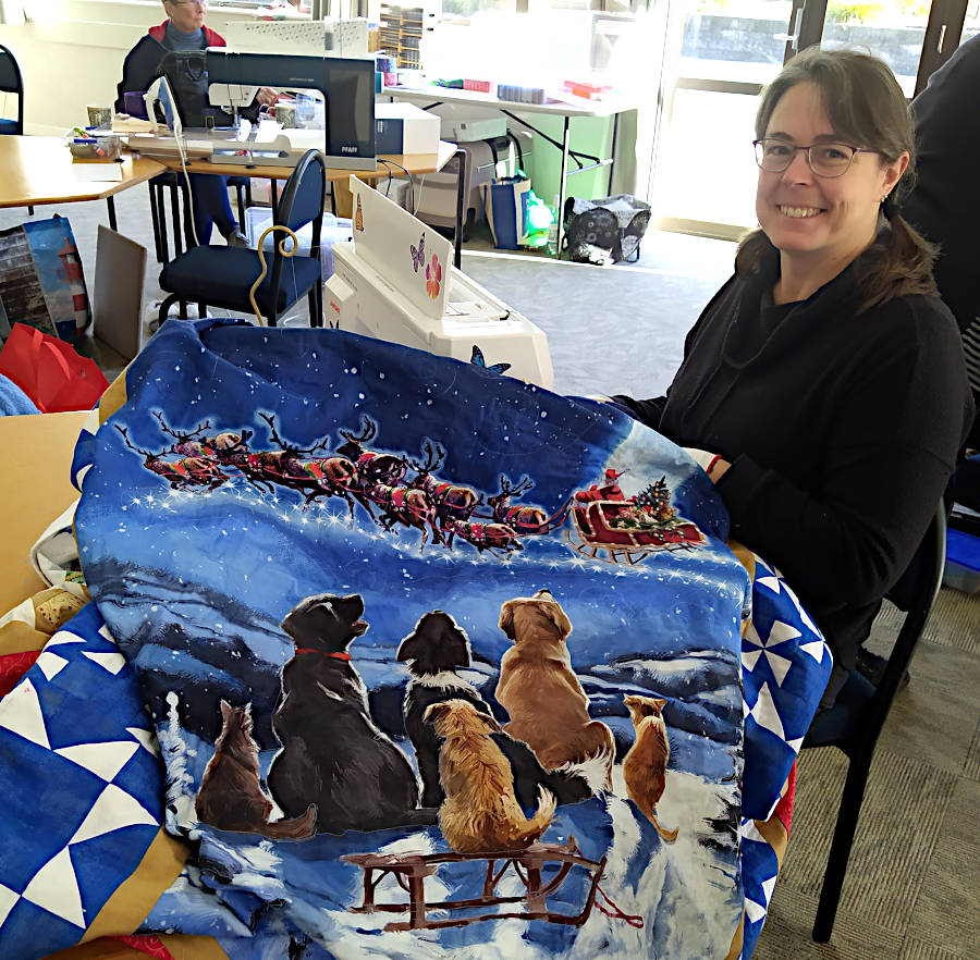 Chris is quilting a festive scene